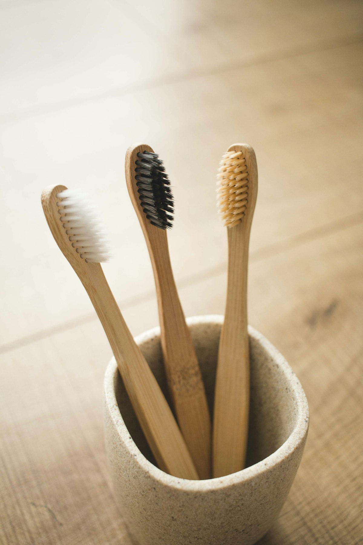 Malo Dental London bamboo manual toothbrush with natural bristles displayed in a biodegradable kraft paper sleeve